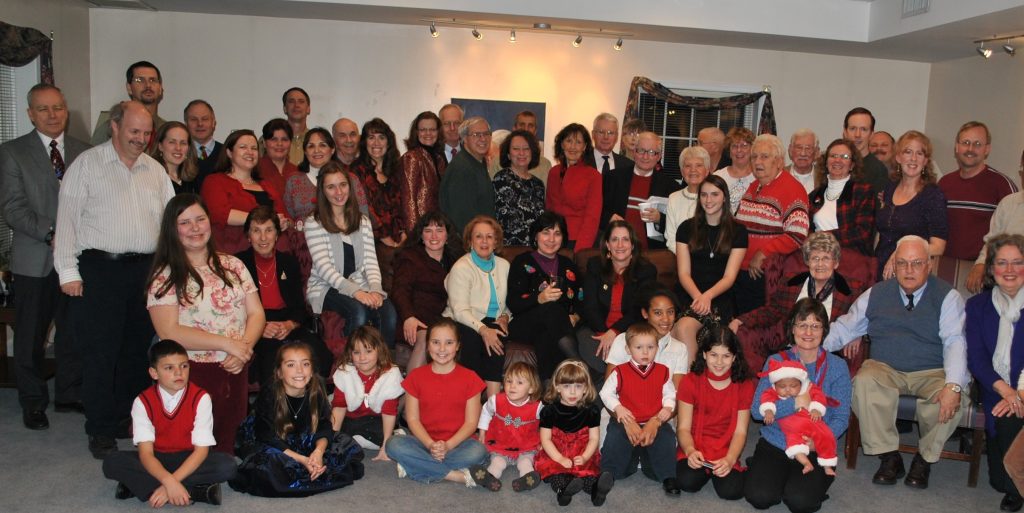 Some of the members of Mother of God Community gather at a Christmas party.